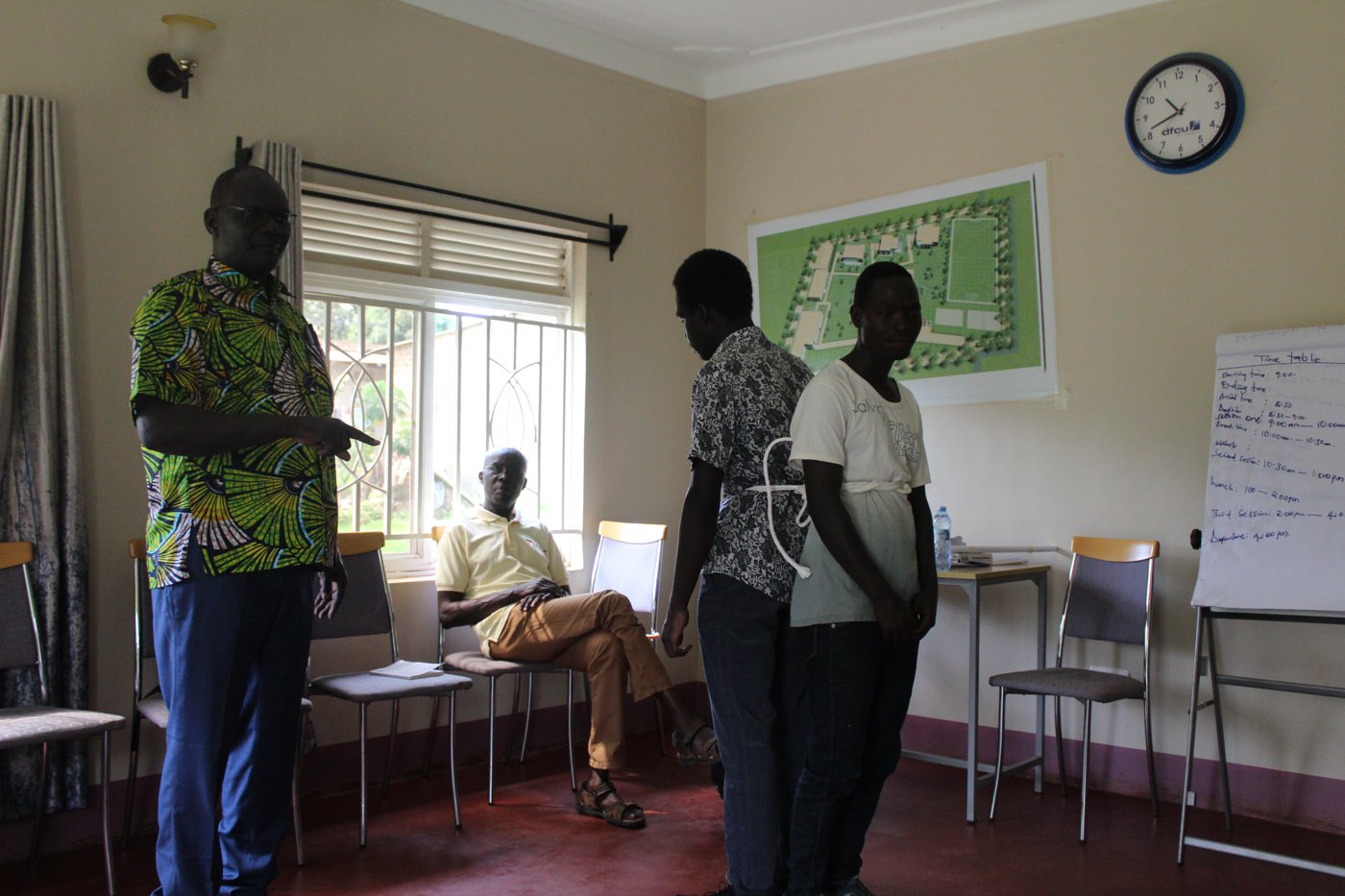 CGALU staff reviewing the training center site plan